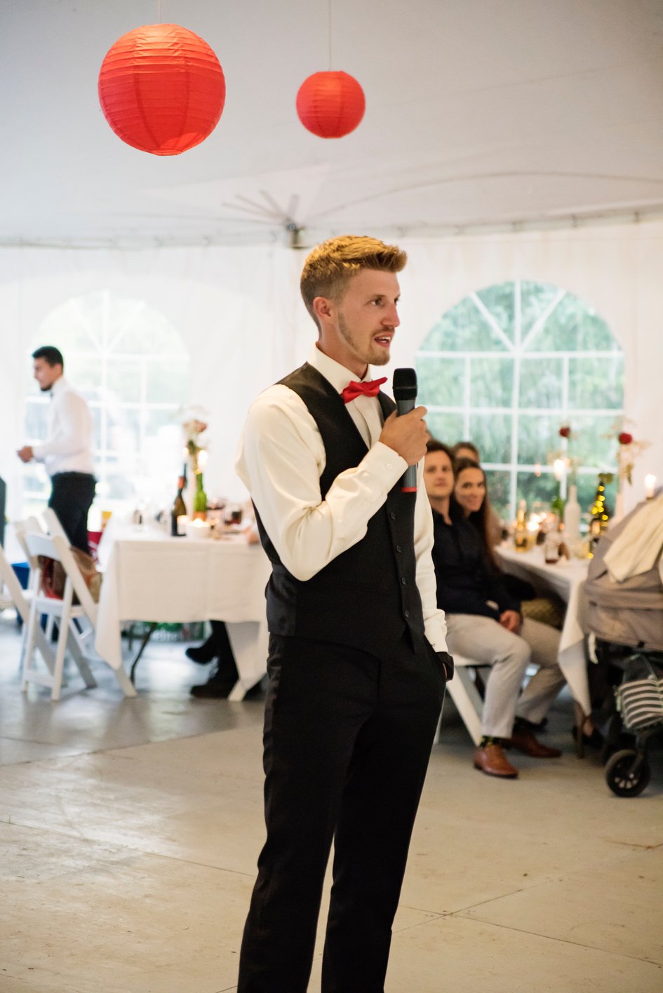 Best man's speech at the table of honour at wedding reception.