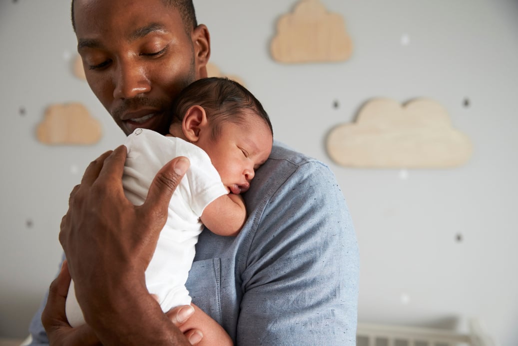 Father Holding Newborn 